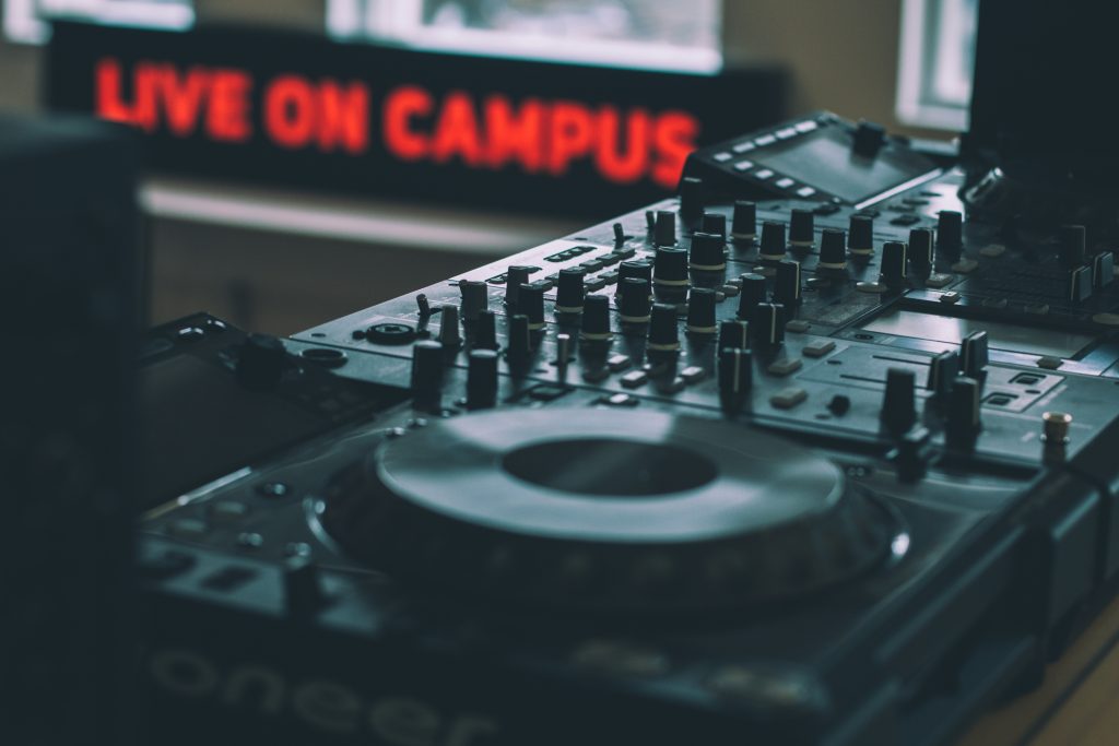Live on Campus sign behind DJ decks