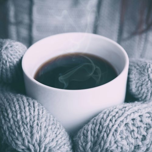 Hands holding a hot drink Hands holding a hot drink