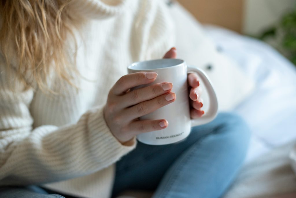 Hands holding a hot drink